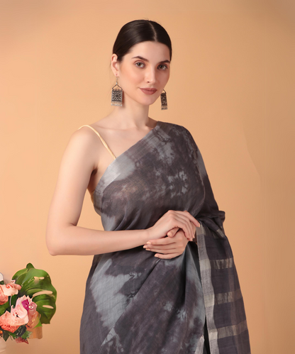 Handwoven linen saree crafted in tie n dyed blue colored base with silver zari border and striped aanchal