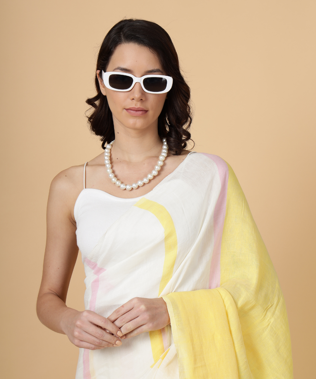 Handwoven linen saree crafted in cream colored base with stripes