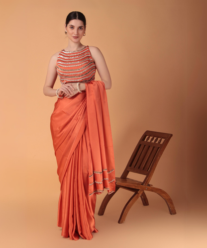 Orange Satin Hand Embroidered Cutwork Saree with Heavy Blouse